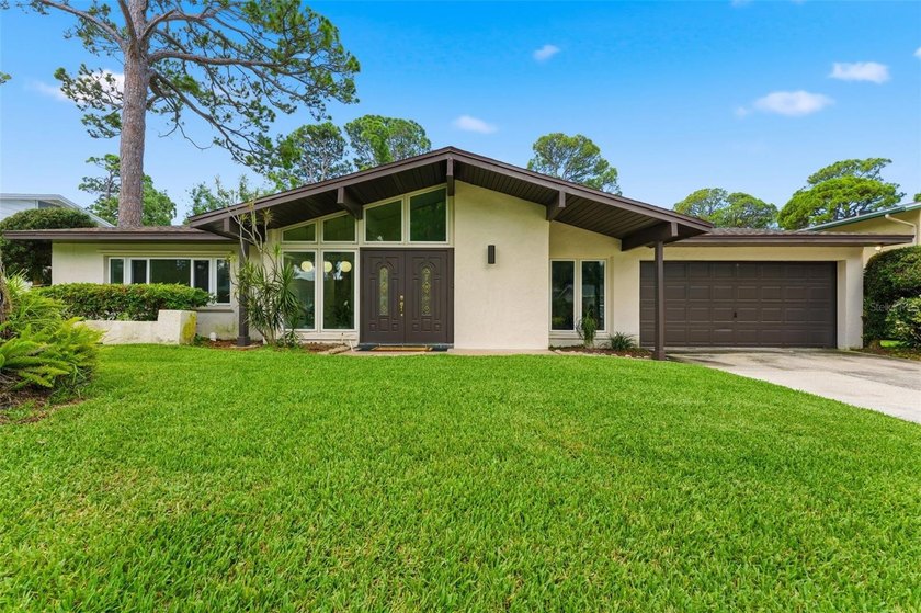 Filled with timeless mid-century charm and lovingly maintained - Beach Home for sale in Seminole, Florida on Beachhouse.com