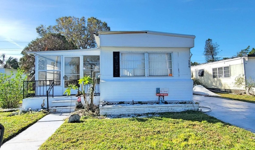 Beautiful Waterfront view, Perfect Location. Desirable home with - Beach Home for sale in Nokomis, Florida on Beachhouse.com