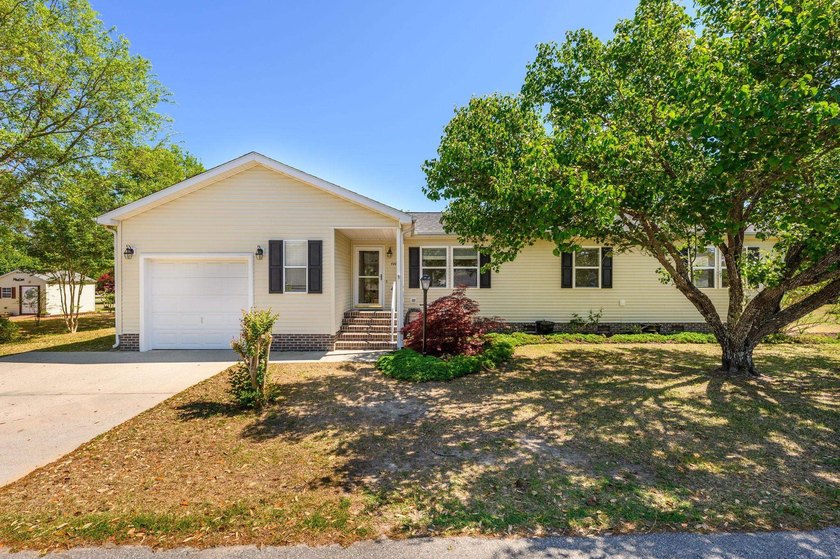 Discover the charm of coastal living in this well-maintained - Beach Home for sale in Little River, South Carolina on Beachhouse.com