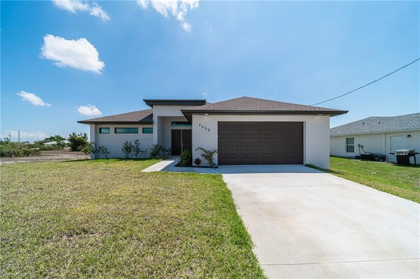 Located in Northwest Cape Coral, this well-designed 3-bedroom, 3 - Beach Home for sale in Cape Coral, Florida on Beachhouse.com