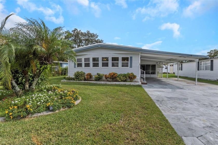 This meticulously maintained double-wide manufactured home is - Beach Home for sale in Palm Harbor, Florida on Beachhouse.com