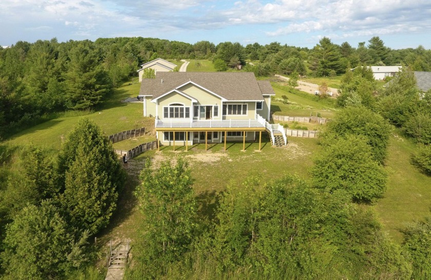 Welcome to this single-family home located on the Black River - Beach Home for sale in Cheboygan, Michigan on Beachhouse.com