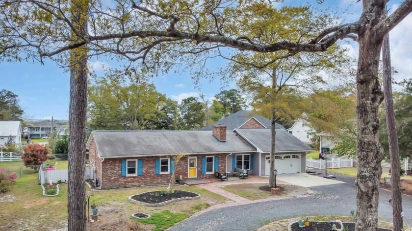 Imagine a charming coastal home situated at the base of the - Beach Home for sale in Sunset Beach, North Carolina on Beachhouse.com