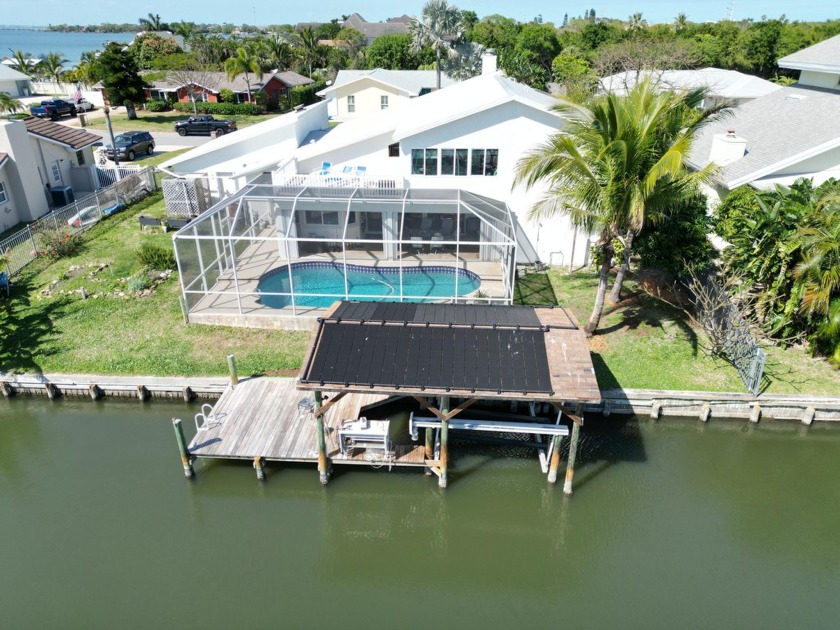 Experience waterfront living at its finest in this canal front - Beach Home for sale in Indialantic, Florida on Beachhouse.com
