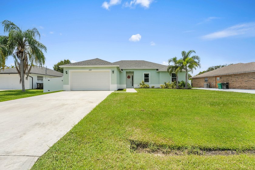 Welcome to 1150 SE Sabina Lane! This stunning 4-bedroom, 2 - Beach Home for sale in Port Saint Lucie, Florida on Beachhouse.com