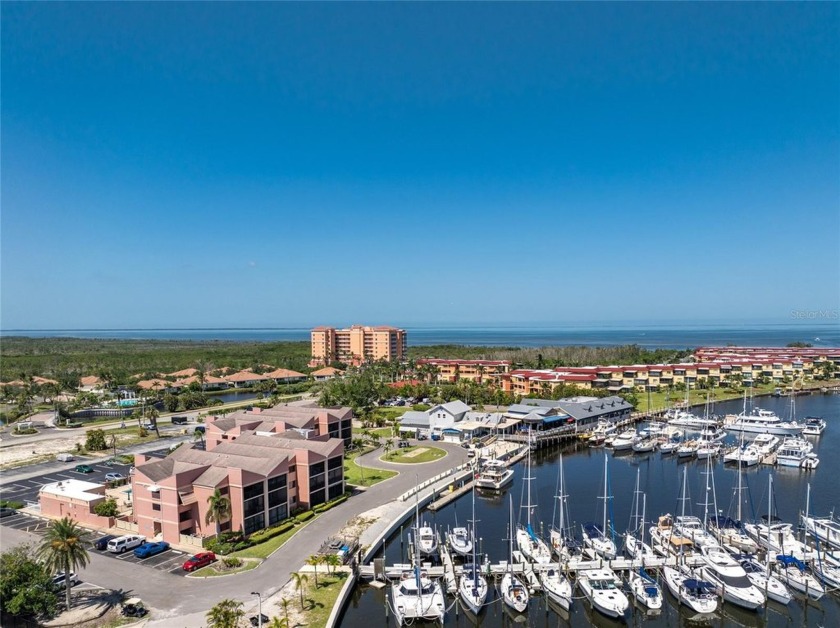 Enjoy front-row seats to the boating action from this charming - Beach Condo for sale in Punta Gorda, Florida on Beachhouse.com