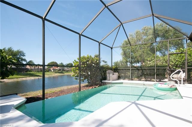 Enter this spacious bright open tropical setting home with - Beach Home for sale in Estero, Florida on Beachhouse.com