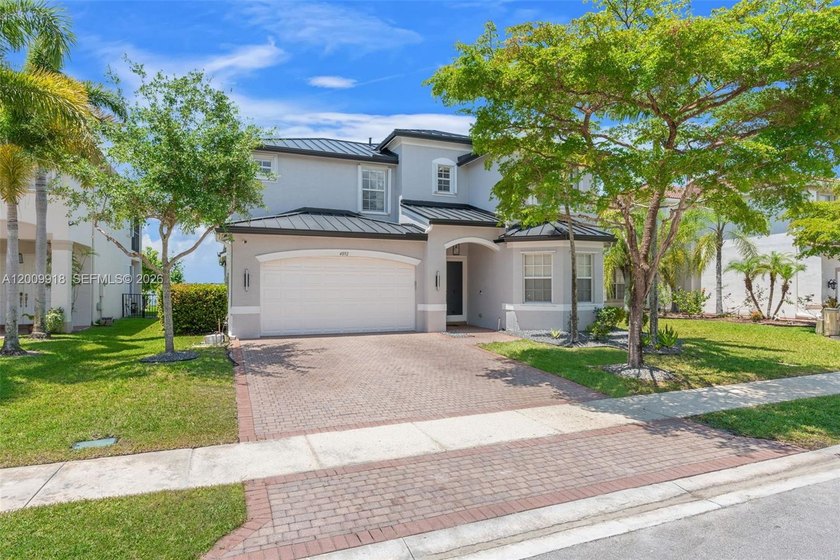 Set within Sunset Falls, this thoughtfully cared for 5-bedroom - Beach Home for sale in Miramar, Florida on Beachhouse.com