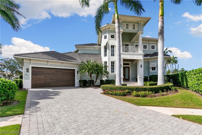 Coastal living at its finest! This stunning waterfront home sits - Beach Home for sale in Marco Island, Florida on Beachhouse.com