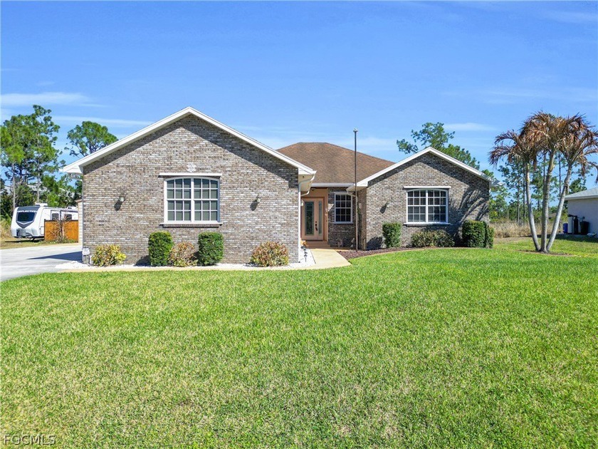 Stunning 4 bedroom 2 baths and 3+ car garage residence on a full - Beach Home for sale in Lehigh Acres, Florida on Beachhouse.com