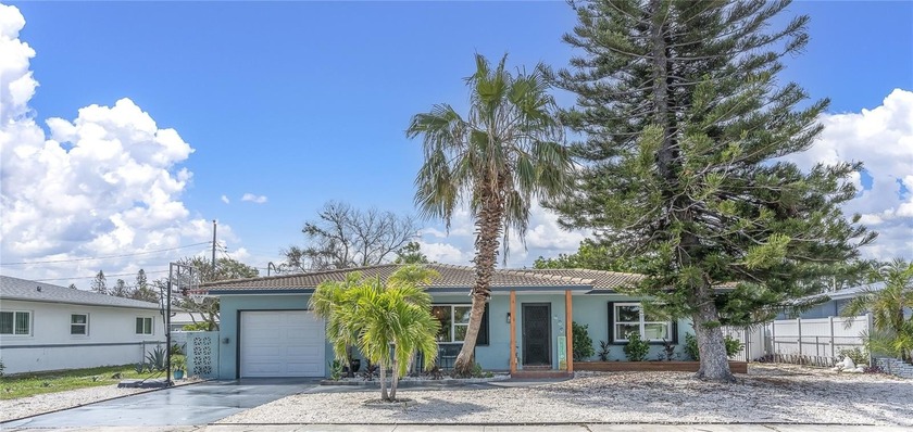 DIVE INTO THE BEACH LIFE OF YOUR DREAMS! This stunningly - Beach Home for sale in ST Pete Beach, Florida on Beachhouse.com