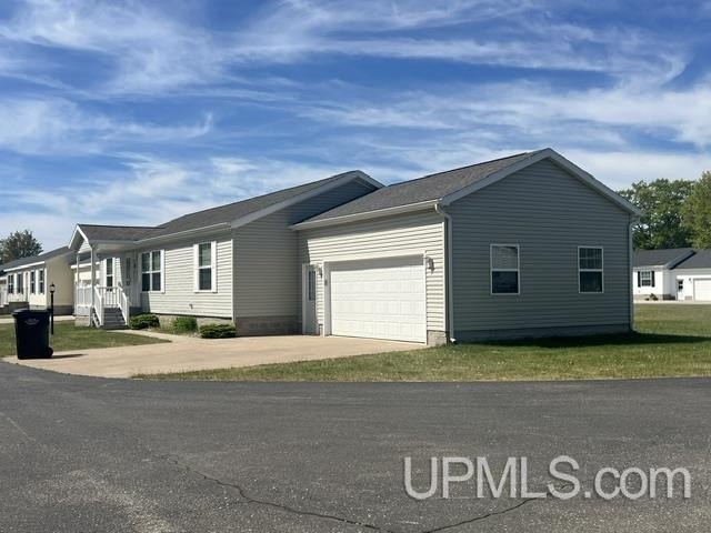 Enjoy carefree, low-maintenance living in the desirable Lake - Beach Home for sale in Gladstone, Michigan on Beachhouse.com