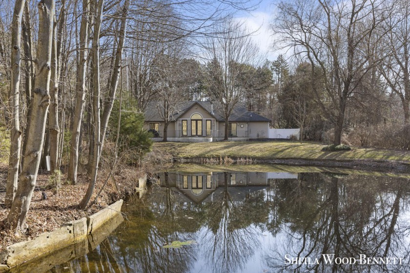 Nestled within the serene embrace of a three-acre woodland - Beach Home for sale in Holland, Michigan on Beachhouse.com