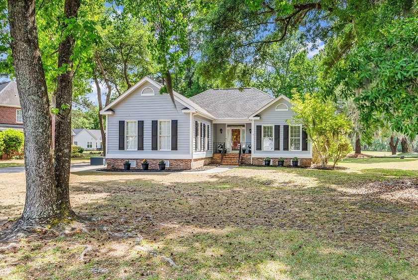 Nestled under the live oaks, in a stately golf course community - Beach Home for sale in Georgetown, South Carolina on Beachhouse.com