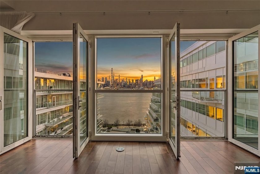 Enjoy waterfront living at its finest in Residence #1010 at - Beach Home for sale in Weehawken, New Jersey on Beachhouse.com