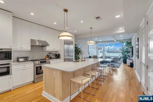 Perched on the top floor, this exceptional 3-bedroom, 2-bath - Beach Home for sale in Edgewater, New Jersey on Beachhouse.com