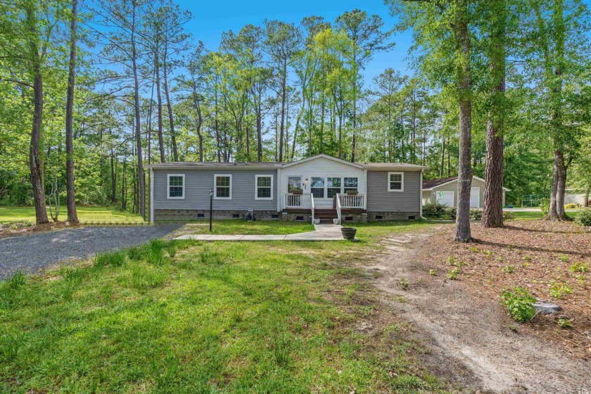 Welcome to a delightful three-bedroom, two-bathroom haven - Beach Home for sale in Calabash, North Carolina on Beachhouse.com