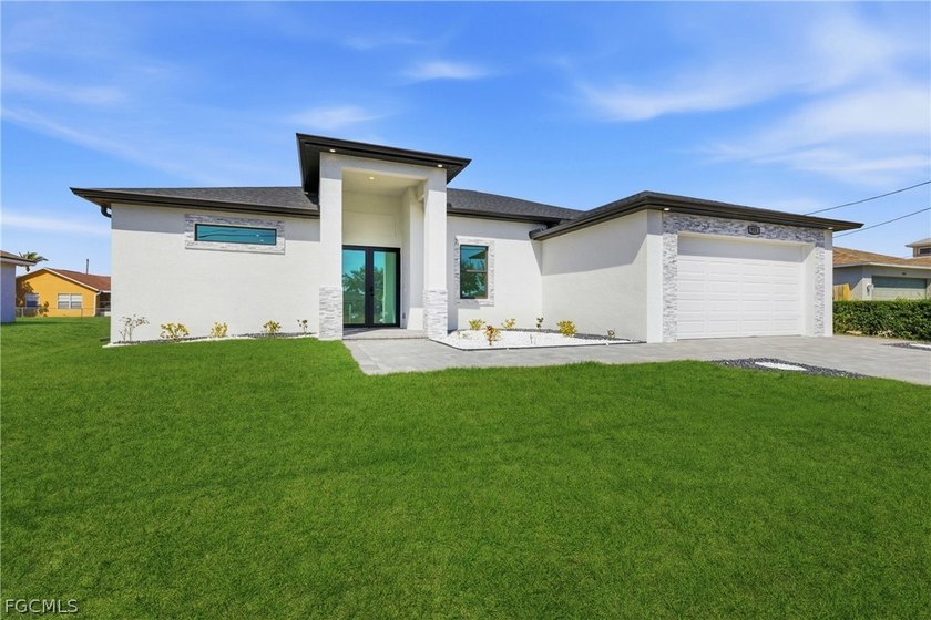 Welcome to this stunning contemporary home located in the highly - Beach Home for sale in Cape Coral, Florida on Beachhouse.com