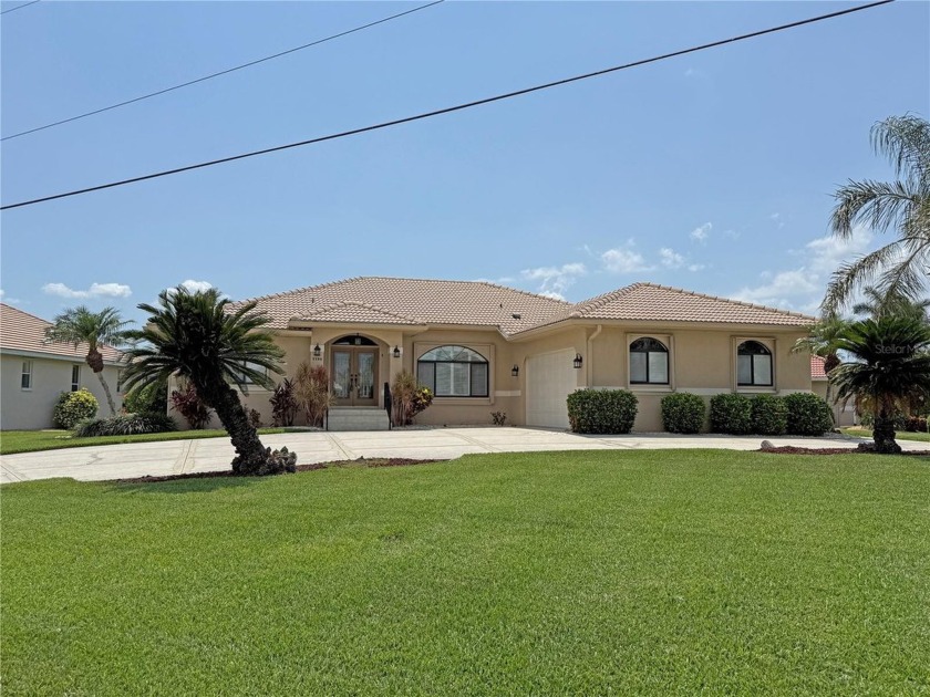 Impressive WATERFRONT home on an oversized lot in desirable deed - Beach Home for sale in Punta Gorda, Florida on Beachhouse.com