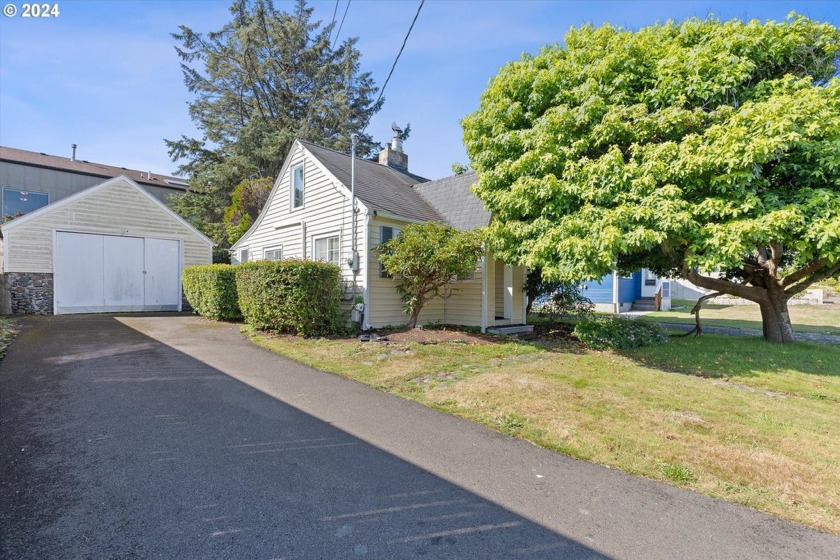 This charming beach cottage is ideally situated between Highway - Beach Home for sale in Lincoln City, Oregon on Beachhouse.com