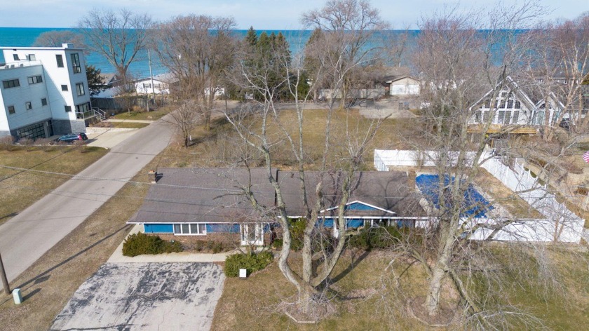Welcome to your coastal oasis! This 4-bed, 2.5-bath gem boasts - Beach Home for sale in New Buffalo, Michigan on Beachhouse.com