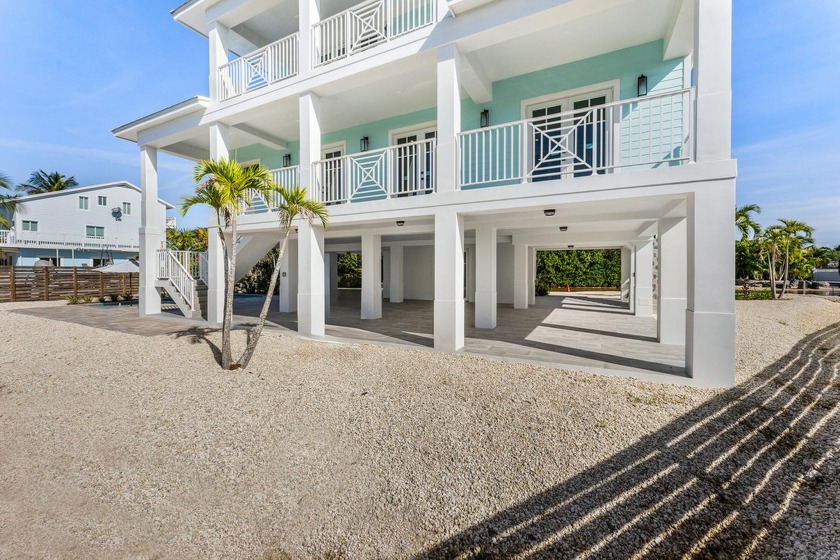 Experience modern coastal design and opulent island living in - Beach Home for sale in Key Largo, Florida on Beachhouse.com