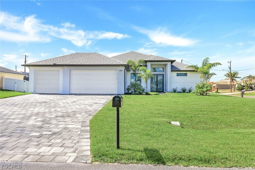 Elegantly designed with an open-concept floor plan, the home - Beach Home for sale in Cape Coral, Florida on Beachhouse.com