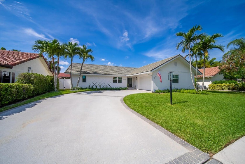 Welcome to this stunning 3 bedroom, 2 bathroom residence tucked - Beach Home for sale in Palm Beach Gardens, Florida on Beachhouse.com