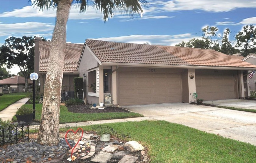 Welcome to this beautifully updated villa in the highly - Beach Home for sale in Palm Harbor, Florida on Beachhouse.com