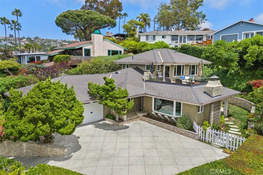 Tucked away on a quiet street just off Temple Hills Drive, this - Beach Home for sale in Laguna Beach, California on Beachhouse.com