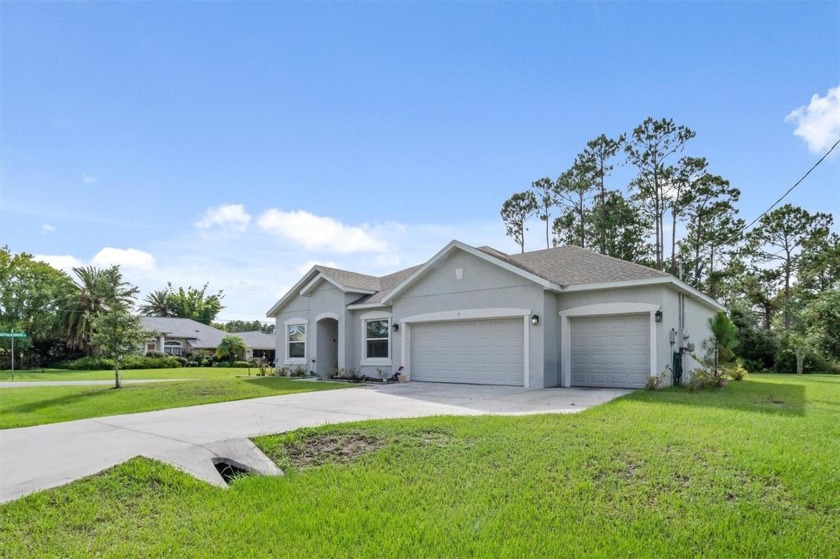 Welcome to this stunning 2021-built home nestled on a spacious - Beach Home for sale in Palm Coast, Florida on Beachhouse.com