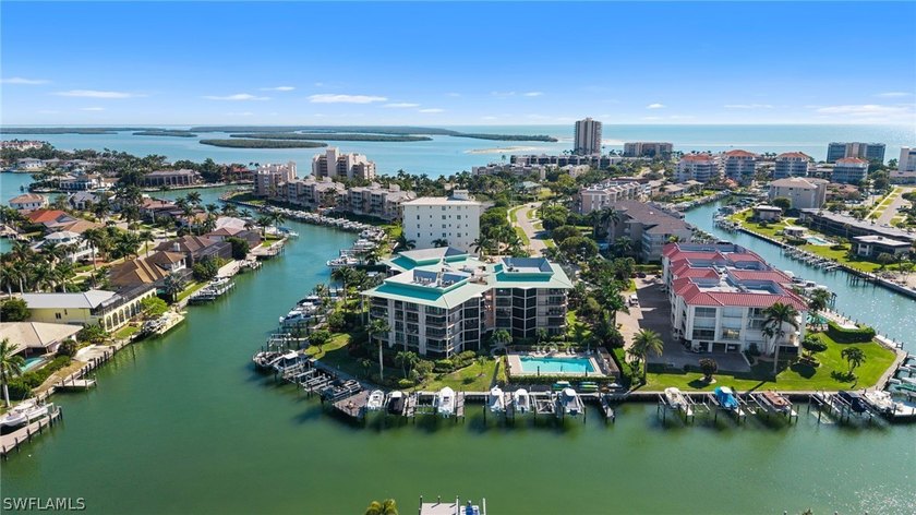 TURNKEY FURNISHED, BOAT DOCK AND WATER VIEWS! Discover the - Beach Condo for sale in Marco Island, Florida on Beachhouse.com