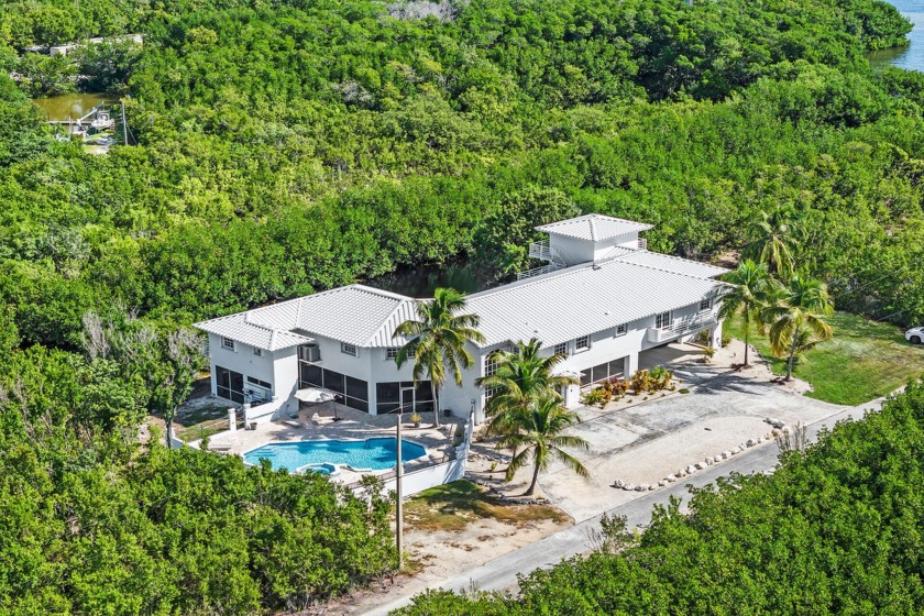 Experience unparalleled privacy in this exquisite five-bedroom - Beach Home for sale in Key Largo, Florida on Beachhouse.com