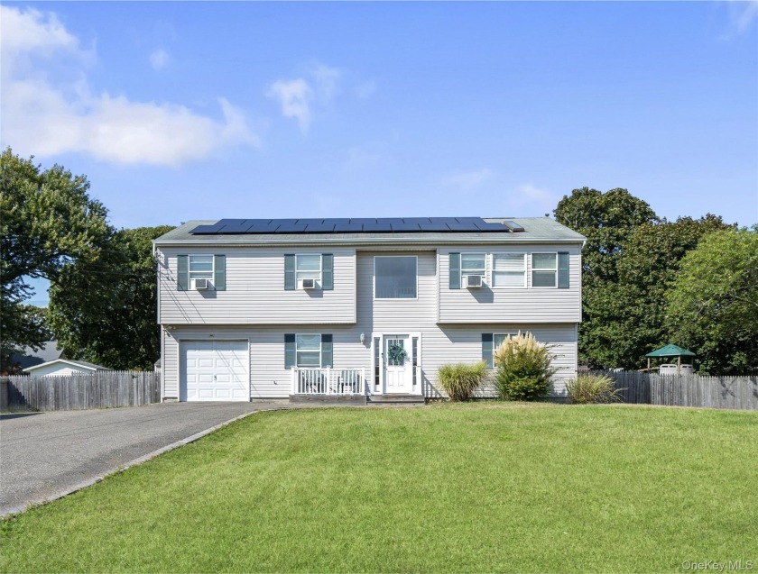 This expansive hi-ranch was built in 2003 and is ideal for - Beach Home for sale in Shirley, New York on Beachhouse.com