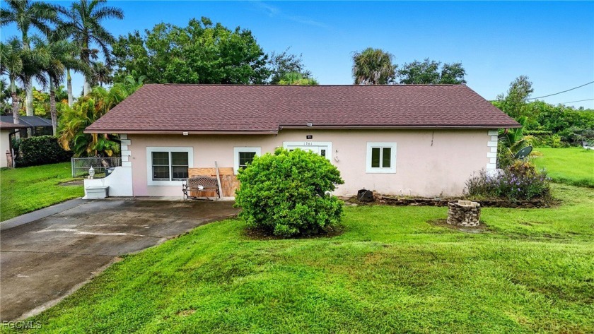 Set on just over half an acre, this 3-bedroom, 2-bath home - Beach Home for sale in North Fort Myers, Florida on Beachhouse.com