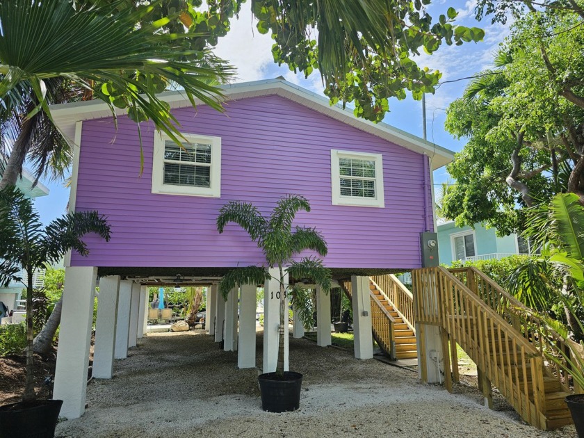 WELCOME TO PURPLE PARADISE. NESTLED BETWEEN A SALT WATER CANAL - Beach Home for sale in Long Key, Florida on Beachhouse.com