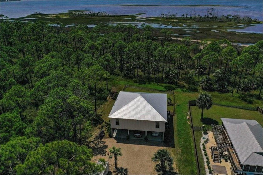 Enjoy beautiful sunsets from the 10'x45' screened in porch - Beach Home for sale in Port St Joe, Florida on Beachhouse.com