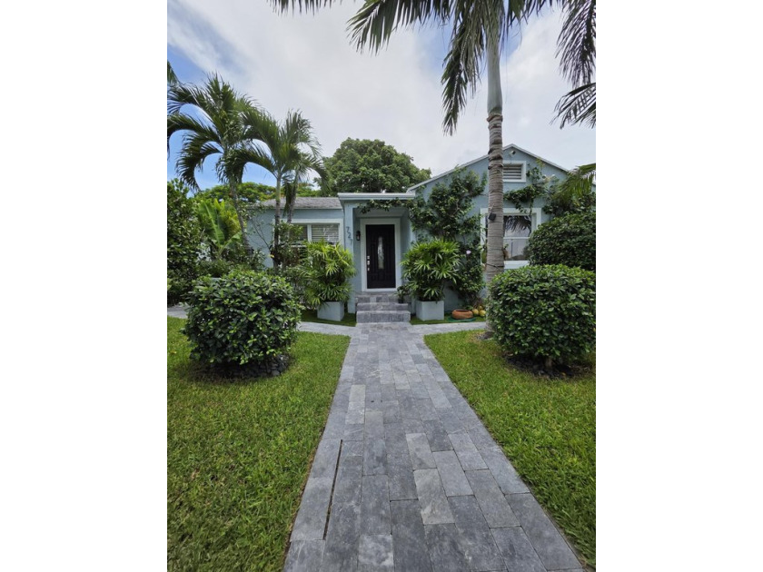 Discover this charming 4-bedroom, 2-bathroom family home nestled - Beach Home for sale in West Palm Beach, Florida on Beachhouse.com