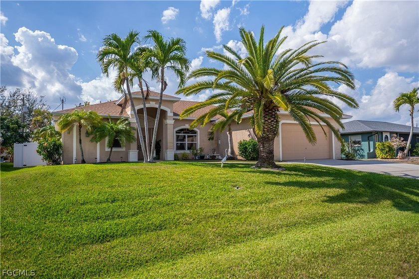 Welcome to this beautiful home with a heated pool and a fenced - Beach Home for sale in Cape Coral, Florida on Beachhouse.com