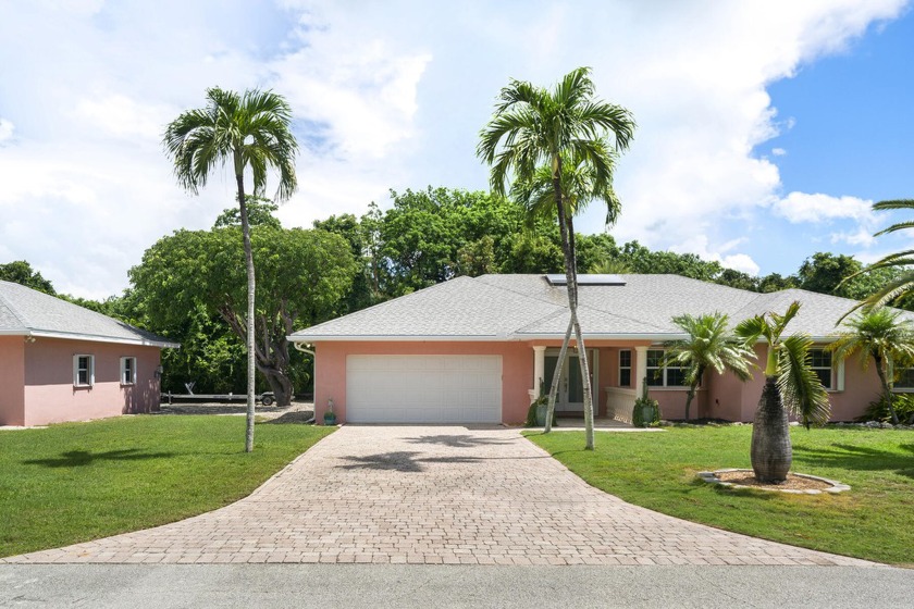 Introducing a remarkable ground-level concrete home spanning - Beach Home for sale in Key Largo, Florida on Beachhouse.com