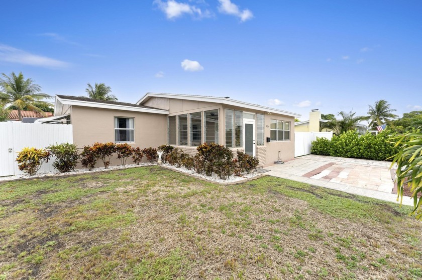 Welcome to this inviting 3-bedroom, 2-bathroom home filled with - Beach Home for sale in West Palm Beach, Florida on Beachhouse.com