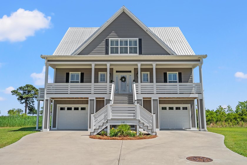 Experience the Lowcountry lifestyle at 141 Oak Bay Place, a - Beach Home for sale in Georgetown, South Carolina on Beachhouse.com