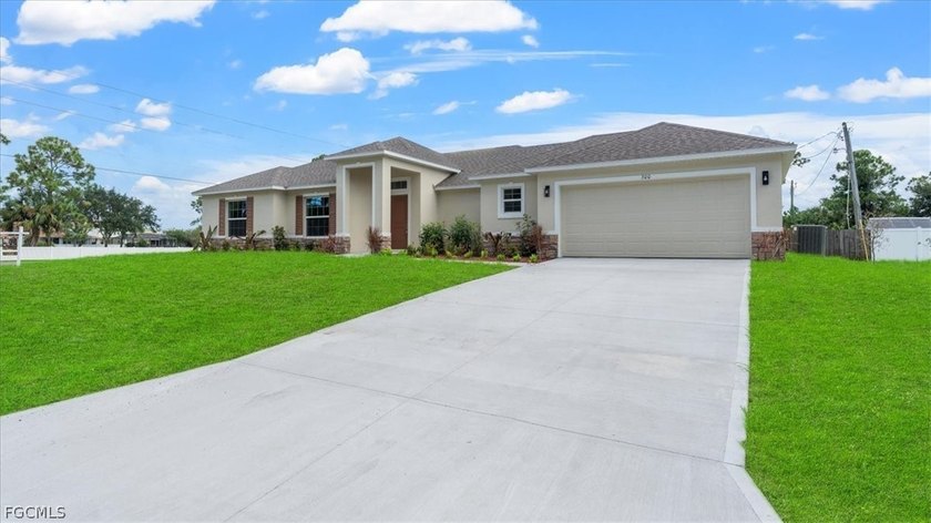 This beautifully designed home features an open-concept floor - Beach Home for sale in Lehigh Acres, Florida on Beachhouse.com