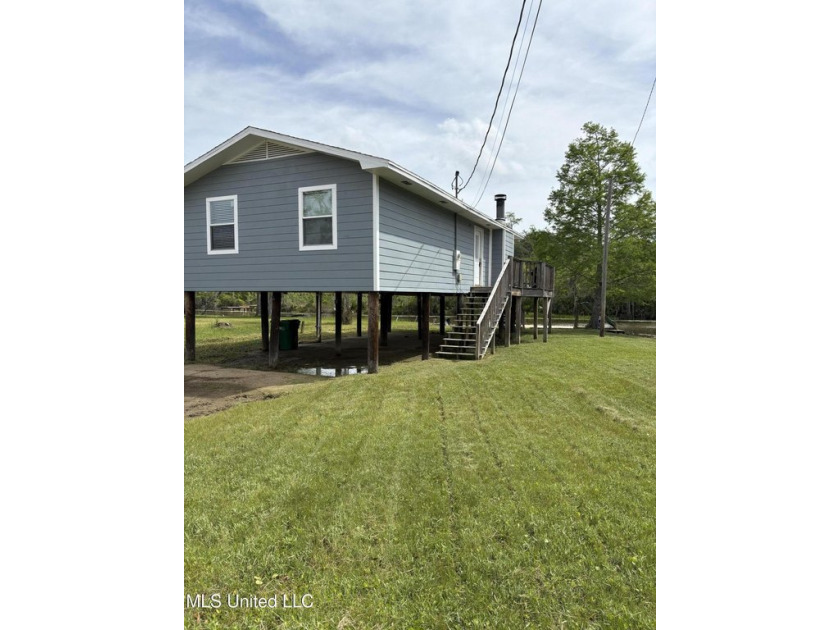 Discover your dream waterfront retreat on the serene banks of - Beach Home for sale in Moss Point, Mississippi on Beachhouse.com