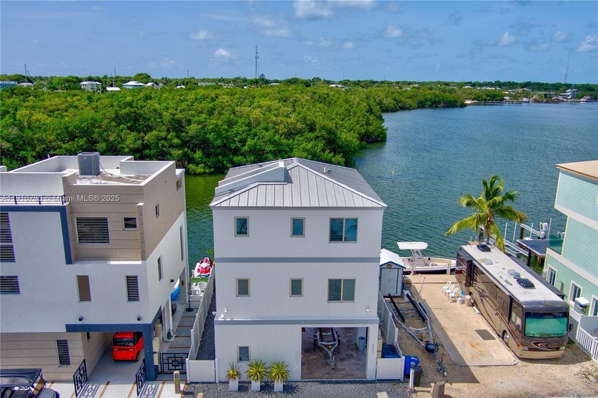 This stunning three-story waterfront home offers panoramic ocean - Beach Home for sale in Islamorada, Florida on Beachhouse.com