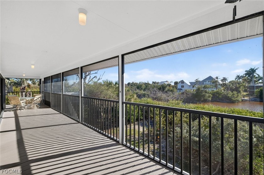 A huge screened lanai spans the full length of this lovely home - Beach Home for sale in Sanibel, Florida on Beachhouse.com