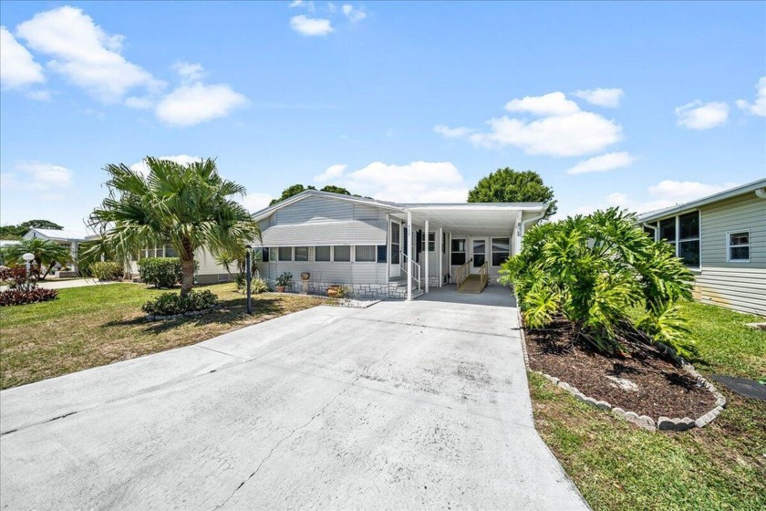 Welcome to Barefoot Bay.  This 2 bedroom 2 bath waterfront home - Beach Home for sale in Barefoot Bay, Florida on Beachhouse.com