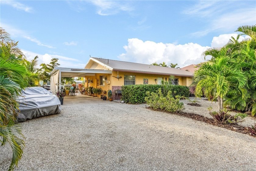 Charming waterfront CBS Home in Desirable St. Jude Harbors - - Beach Home for sale in St. James City, Florida on Beachhouse.com