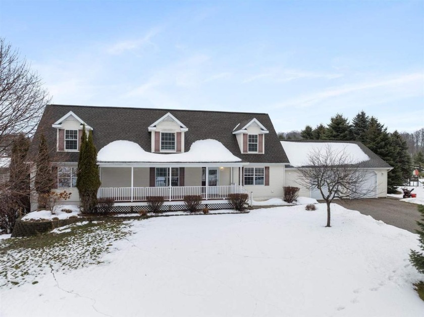 This charming 4-bedroom, 3.5-bath Cape Cod-style home is nestled - Beach Home for sale in Petoskey, Michigan on Beachhouse.com