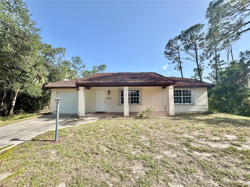 Tucked away in a peaceful, wooded setting, this charming - Beach Home for sale in Port Charlotte, Florida on Beachhouse.com
